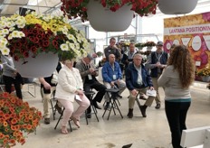 Visitors listening to a presentation about Cha-Cha Calibrachoa of Ball FloraPlant